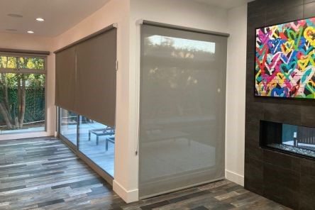 Long Beach living room featuring high quality custom sheer window shades fully closed on spacious sliding doors, enhancing privacy and style.