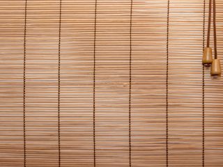 Eco-friendly woven wood shades complementing modern interior design.